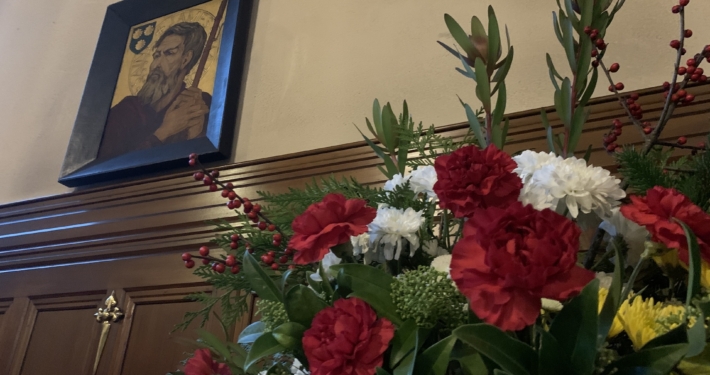 Christmas flowers at St. James' under the icon of St. James.
