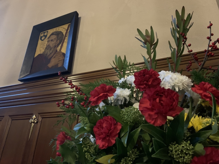 Christmas flowers at St. James' under the icon of St. James.